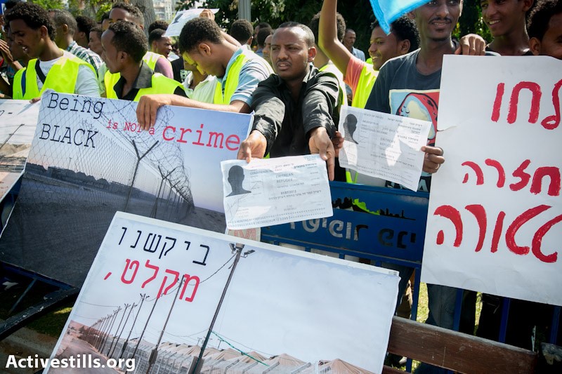 Eritrean refugees living in Israel take part in a protest outside the ministry of defense on October 18, 2012, in Tel Aviv. The protesters called for their recognition as refugees and for the immediate end of the Israeli governments' jailing policy (Photo: Activestills)