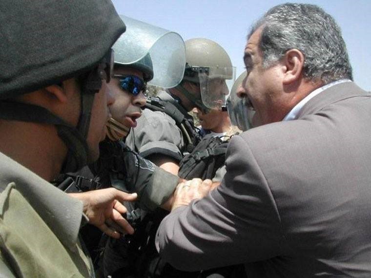MK Barakeh during a demonstration in the Palestinian village of Bil'in in the occupied West Bank (Photo: Al Ittihad)