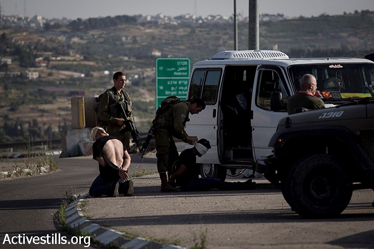 Palestinian arrested by occupation soldiers near Hebron, last week (Photo: Activestills)