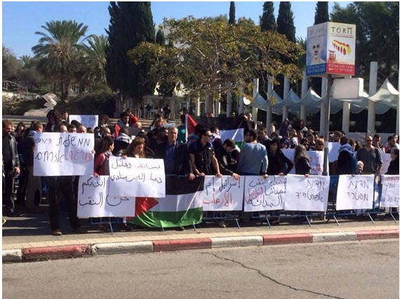 Demonstrators protest against police violence on Tuesday at Tel-Aviv University. Among the protesters were Hadash MKs Muhammad Barakeh and Dov Khenin.