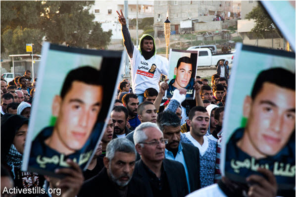 Arab-Bedouin mourners participate in a rally in the southern Israeli city of Rahat to condemn the death of Sami al-Ja’ar, 22, who died of a gunshot wound last week during a police raid in the Negev town, and of Sami al-Ziadna, who was killed during clashes with Israeli police following the funeral of al-Ja’ar. The protesters marched from the house of the al-Ja’ar family to the al-Ziadna family home, January 20, 2015.