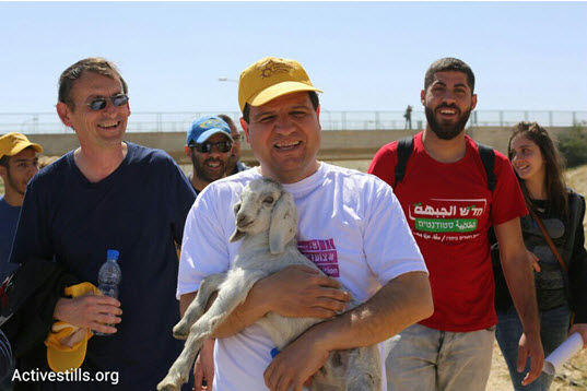Joint List head Ayman Odeh (center) and MK Dov Khenin (left) on a four-day trek starting from the unrecognized Bedouin villages in the Negev, March 26, 2015.