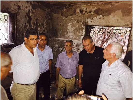 Leading activists from Hadash and the CPI conducted a solidarity visit on Monday, August 3 at the home of the Dawabsheh family in the occupied village of Duma; first from left: CPI General Secretary, Adel Amer.