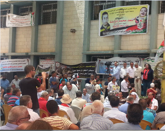 Part of the crowd attending Saturday's solidarity visit at Duma. Addressing the audience, MK Aida Touma-Sliman