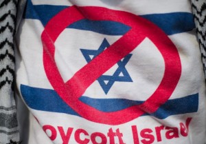 A demonstrator wears a shirt reading 'Boycott Israel'