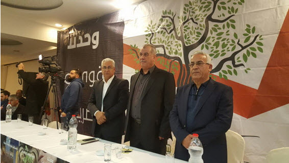 The main speakers' table at the conference held Saturday evening in Shefamr to mark International Arab Rights in Israel Day; in the center, Mohammed Barakeh