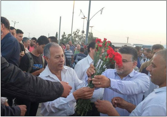 Hadash MKs Abdallah Abu-Ma'arouf, left, and Yousef Jabareen at Eyal checkpoint north of Kalkilya on May Day