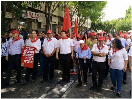 Leaders of Hadash and the Communist Party of Israel (CPI) among the marchers in the May Day parade which was held in Nazareth on April 30. In the first row, from left to right: Issam Makhoul, head of the Emil Touma Institute for Palestinn and Israeli Studies; MK Dov Khenin (holding sign); CPI General Secretary Adel Amer; MK Ayman Odeh, head of the Joint List; from the right: MK Aida Touma-Sliman and MK Yousef Jabareen