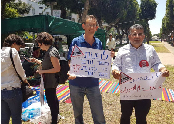Hadash MKs Dov Khenin and Youssef Jabareen near the protest tent on Tel Aviv’s central Rothschild Boulevard on Friday, May 20