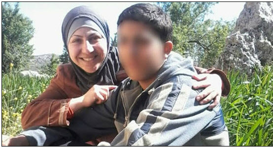 A Palestinian mother together with her minor son being held by Israel in administrative detention (Photo: B'Tselem) 