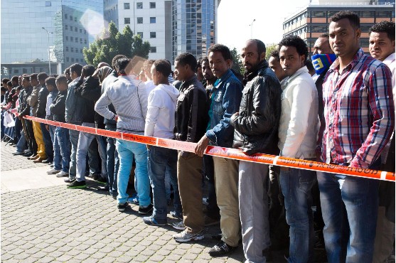 Outside the office of the Ministry of the Interior in Tel Aviv, asylum seekers wait in line for hours to renews their visa (or to receive a summons to be placed in the detention camp "Holot" in the Negev)