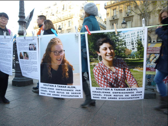 Demonstrators in Paris hold a solidarity vigil for Alon and Ze'evi.