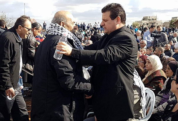 MK Ayman Odeh (Hadash), Chairman of the Joint List, with Hossam Makhlouf, a resident of Qalansawe whose home was demolished this week. In the background, among the thousands who attended Friday’s rally against home demolitions.