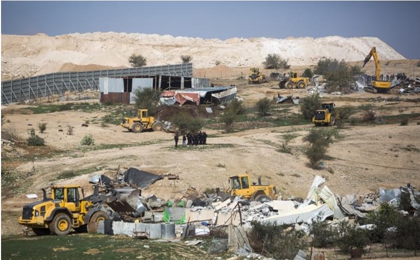 Bulldozers demolish houses and agriculture structures in the unrecognized Bedouin village of Umm al Hiran, Negev desert, Israel, January 18, 2017.