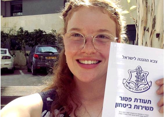 Occupation objector Tamar Alon proudly displays her official exemption from military service after spending a total of 130 days in military prison.