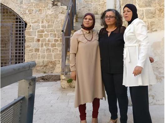 MK Touma-Sliman (center) with relatives of murdered women at the “She is Gone” exhibition in Tel Aviv, last Sunday July 16