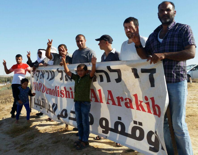 Demonstrators protest the latest threatened demolition of Al-Araqib last Sunday, July 30, 2017, at Lehavim Junction in the Negev, two days before the operation razed the village for the 116th time.