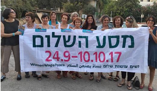Women Wage Peace activists with a banner for their two-week march for peace