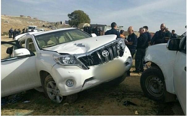 Israeli police stand next to a vehicle that rammed into police officers in the Arab-Bedouin village of Umm al-Hiran in the Negev desert, January 18, 2017.