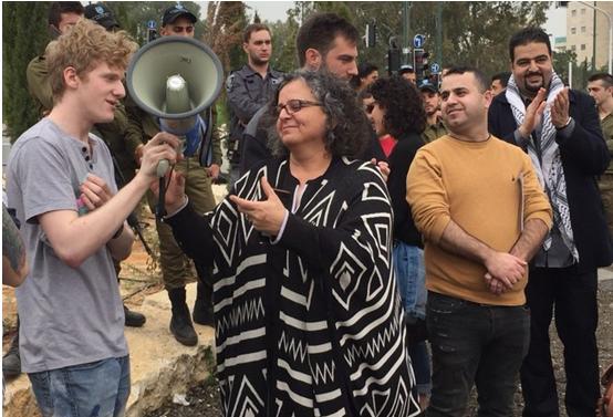 MK Aida Touma-Sliman and draft refuser Saar Yahalom (on the left) at the protest outside the Israeli military induction base on Sunday. To Touma-Sliman's right, hands folded, is Arafat Badarneh, General Secretary of the Young Communist League in Israel.