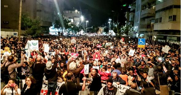 More than 20,000 demonstrated in south Tel Aviv against the deportation of African refugees and asylum seekers, February 24, 2018.