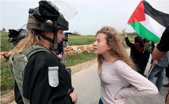 Ahed Tamimi confronts an Israeli soldier in Nabi Saleh.