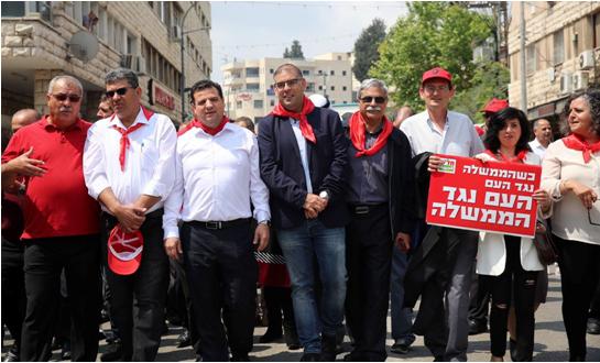 The May Day march in Nazareth, last Saturday, April 28. From right to left: Hadash MK Aida Touma-Sliman, MK Dov Khenin (holding the red sign), former Nazareth Mayor Ramez Jerayssi, Hadash’s candidate for the upcoming mayoral election in Nazareth, Mus'ab Dukhan, MK Ayman Odeh, General Secretary of the CPI, Adel Amer and former MK Mohammad Barakeh (in red shirt).