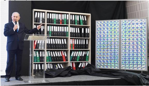 Netanyahu, last Monday, and a bookcase of empty folders purporting to illustrate the trove of Iranian files allegedly in Israel's possession about Iran's nuclear subterfuge