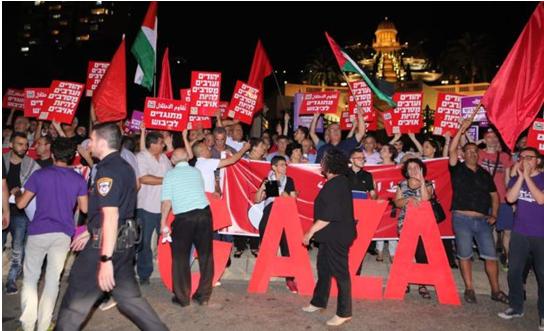 Several hundred people, Jews and Arabs, attended a protest on Sunday evening, May 20, organized by Hadash, the Communist Party of Israel, Standing Together, and Combatants for Peace in Haifa’s German Colony.