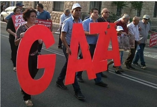 Members of Hadash and the Communist Party of Israel demonstrate in Haifa’s German Colony on Friday, June 1, to display solidarity with the Palestinian people in the Gaza Strip.