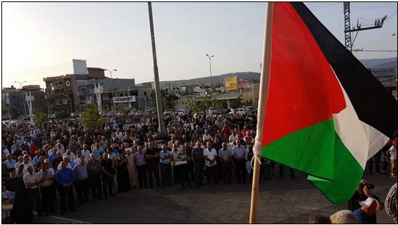 Demonstrators protest house demolitions in Sakhnin, Tuesday evening, July 24.