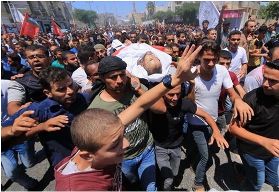 One of the three funeral processions held on Saturday, August 11, for the victims of Israeli fire during the 20th consecutive "Great March of Return" a day earlier