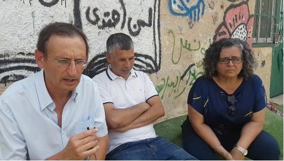 Hadash MKs Dov Khenin (left) and Aida Touma-Sliman (right) at a meeting with Khan al-Ahmar residents and peace activists, on Thursday, September 13
