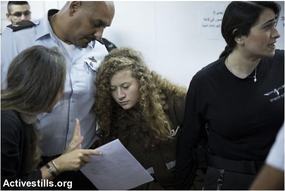 Israeli lawyer Gaby Lasky (left) confers with her client, 16 year old Ahed Tamimi (center), before a hearing at the military court in Ofer military prison, near the West Bank city of Ramallah, January 15, 2018.