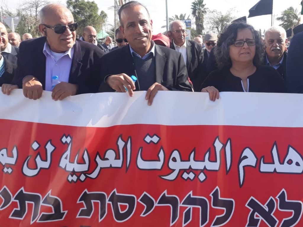 Among the demonstrators against the pending demolition of 17 homes in Qalansawe, last Friday, February 8, were Hadash MK Aida Touma-Suleiman, right, and Hadash Secretary General Mansour Dehamshe, center