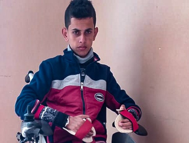 Attiya Nabaheen, paralyzed and confined to a wheelchair for the rest of his life, after he was shot by Israeli armed forces in Gaza on his 15th birthday