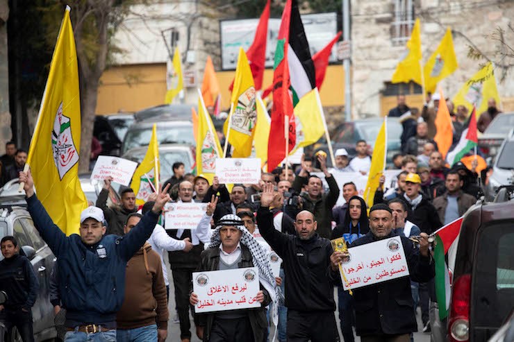 Hundreds of Palestinian, Israeli and international protesters march in Hebron to demand the end of settlements and segregation in the city, February 22, 2019.