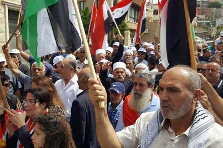 Protesters in the town of Majdal Shams in the occupied Golan Heights decry Israel's occupation policy on October 20, 2018.