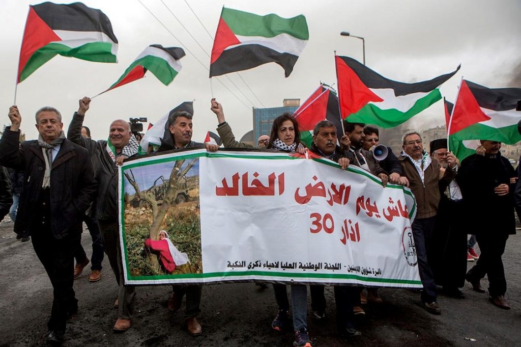 Palestinians take part in a Land Day demonstration held in the city of Al-Bireh just south of the Israeli settlement of Beit El, in the occupied West Bank on March 30, 2019.
