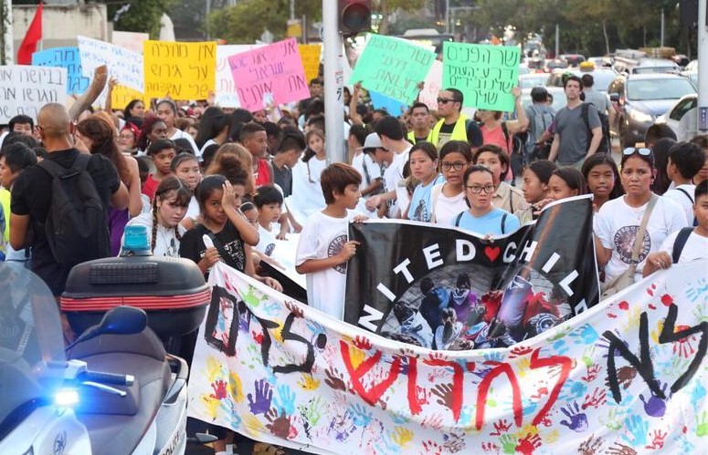 Children and their Filipina mothers demonstrate in central Tel Aviv against their looming deportation from Israel, Tuesday, August 6. The Hebrew banner reads: "No deportation of children." 