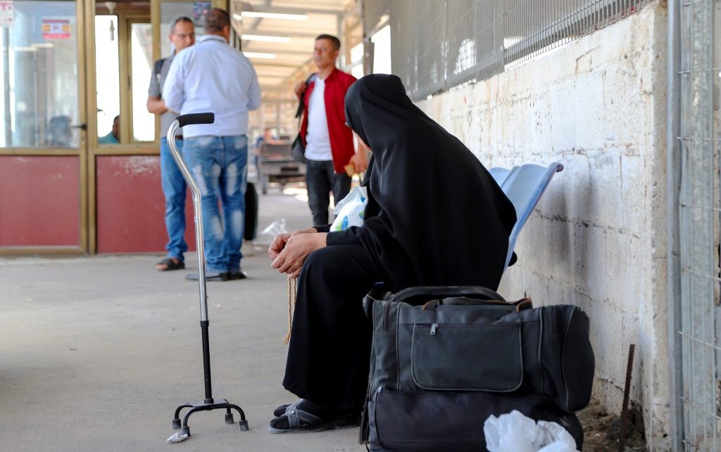 A woman waiting at the Palestinian side of Erez Crossing between Gaza and Israel