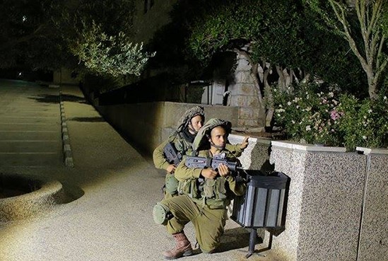 Israeli military forces during a raid of the Birzeit campus in 2014