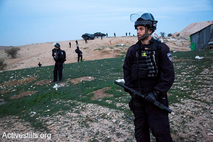 Israel police officers armed with black, sponge-tipped bullets during the evacuation of the Arab-Bedouin village Umm al-Hiran, January 18, 2017