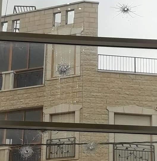 Bullet holes riddle a window of the home of Hadash's Mayor of Sakhnin, Dr. Safuat Abu Riya, after a criminal attack by local youths, Friday, December 13.