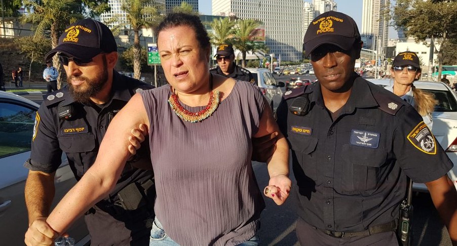 Inbal Hermoni, Chairwomen of the Social Workers Union, is arrested by police during a workers' demonstration in Central Tel Aviv, August 1, 2019.