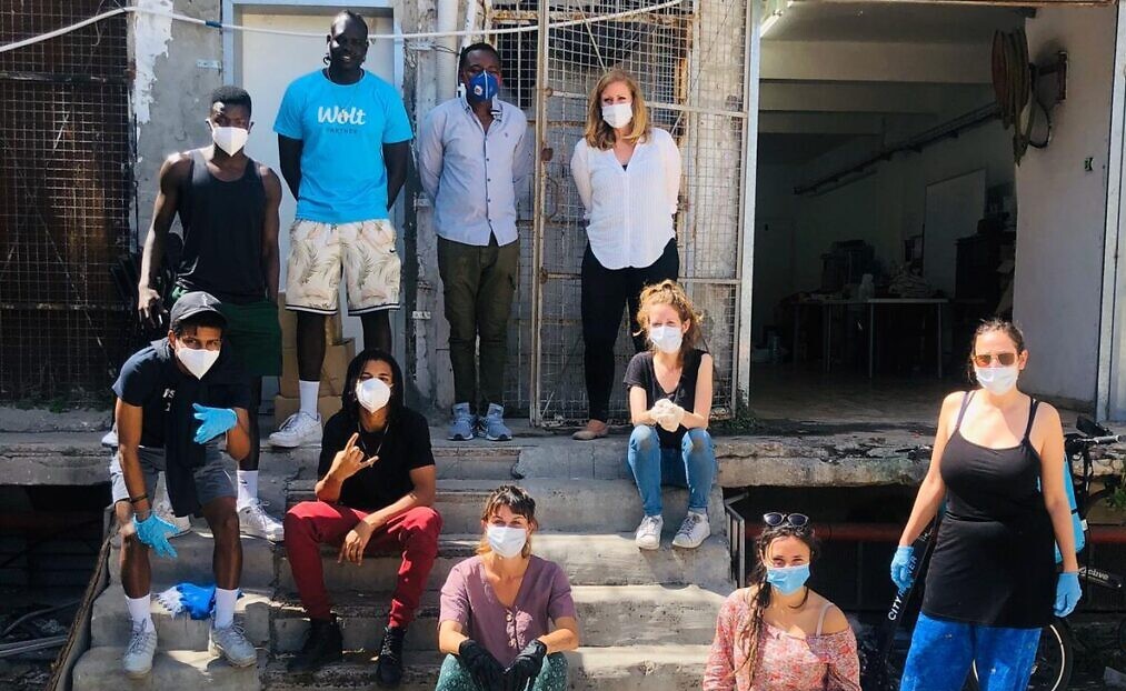 Volunteers with the African Refugee Development Center prepare to deliver food packages to African asylum seekers in south Tel Aviv, April 3, 2020.