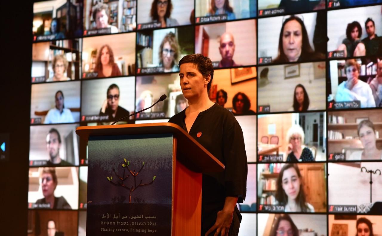 Bereaved Israeli family member, Tal Kfir, speaks during the joint Israeli-Palestinian Memorial Day ceremony broadcast from Tel Aviv on Monday evening, April 27.