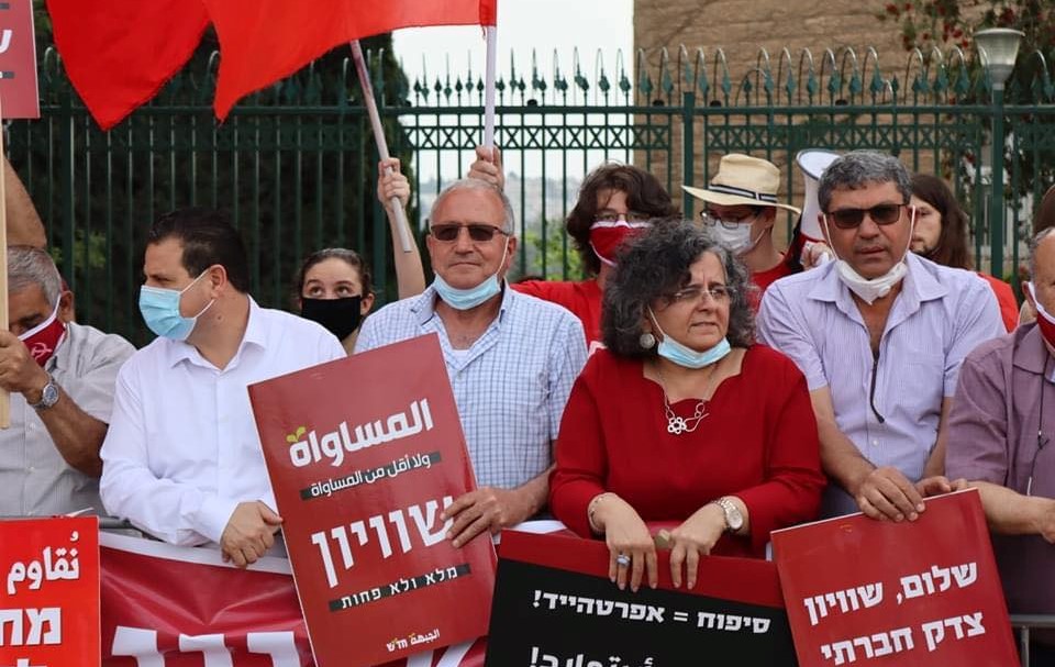 Scores of members of Hadash and the Communist Party of Israel protested against the new government near the Knesset, last Thursday evening, May 14. From left to right in the photo: MK Ayman Odeh, Head of the Joint List; Majid Abu-Younes, a leader of Hadash's faction in the Histadrut; MK Aida Touma-Sliman; and Adel Amer, Secretary General of the Communist Party of Israel.