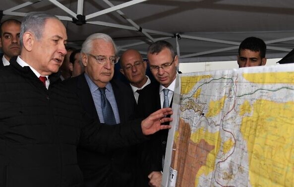 Prime Minister Benjamin Netanyahu, left, US Ambassador to Israel David Friedman, center, and then-Tourism Minister Yariv Levin (right – today, Speaker of the Knesset), during an on-site meeting to discuss mapping Israel's annexation of areas of the occupied West Bank, held within in the settlement of Ariel, February 24, 2020