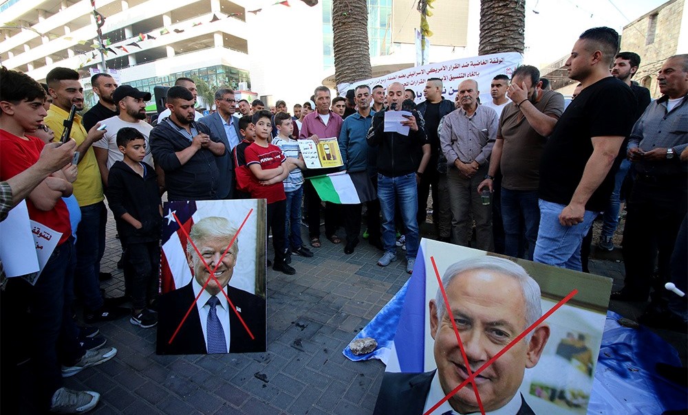 Palestinians protest the US-Israeli "Deal of the Century" in the city of Nablus in the northern West Bank, May 30, 2020.